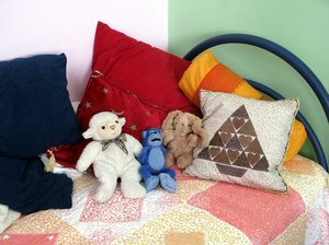 Child's bed with stuffed animals